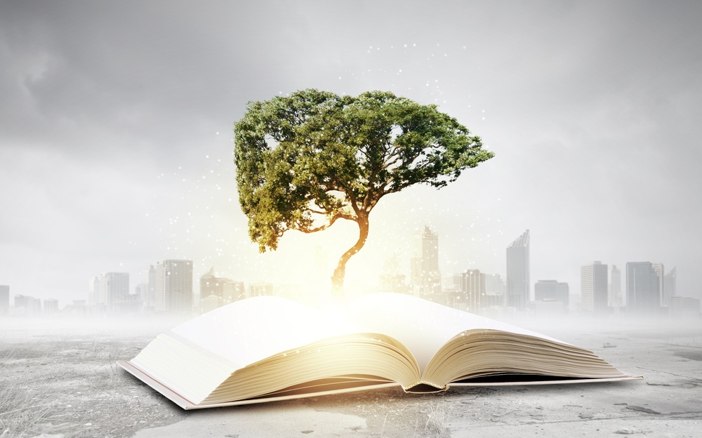 Concept of education and knowledge with tree growing from book-1