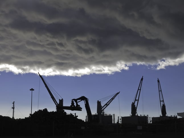 Storm cloud over silhouettes of cranes lifting logs to be shipped from seaport of Astoria, Oregon.jpeg Storm cloud over silhouettes of cranes lifting logs to be shipped from seaport of Astoria, Oregon.jpeg